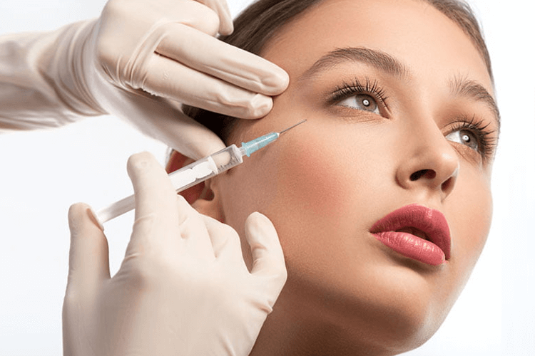 lips and teeth photo of smiling patient receiving filler treatment