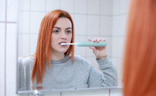 Women Brushing Her Teeth